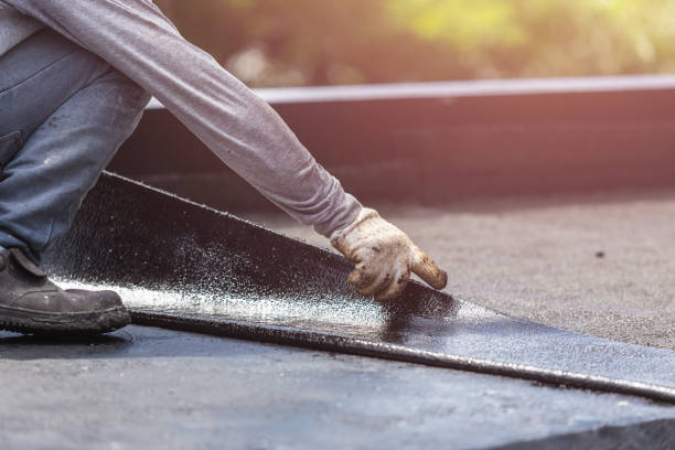 Professional Basement Waterproofing technician working in Norwich, KS